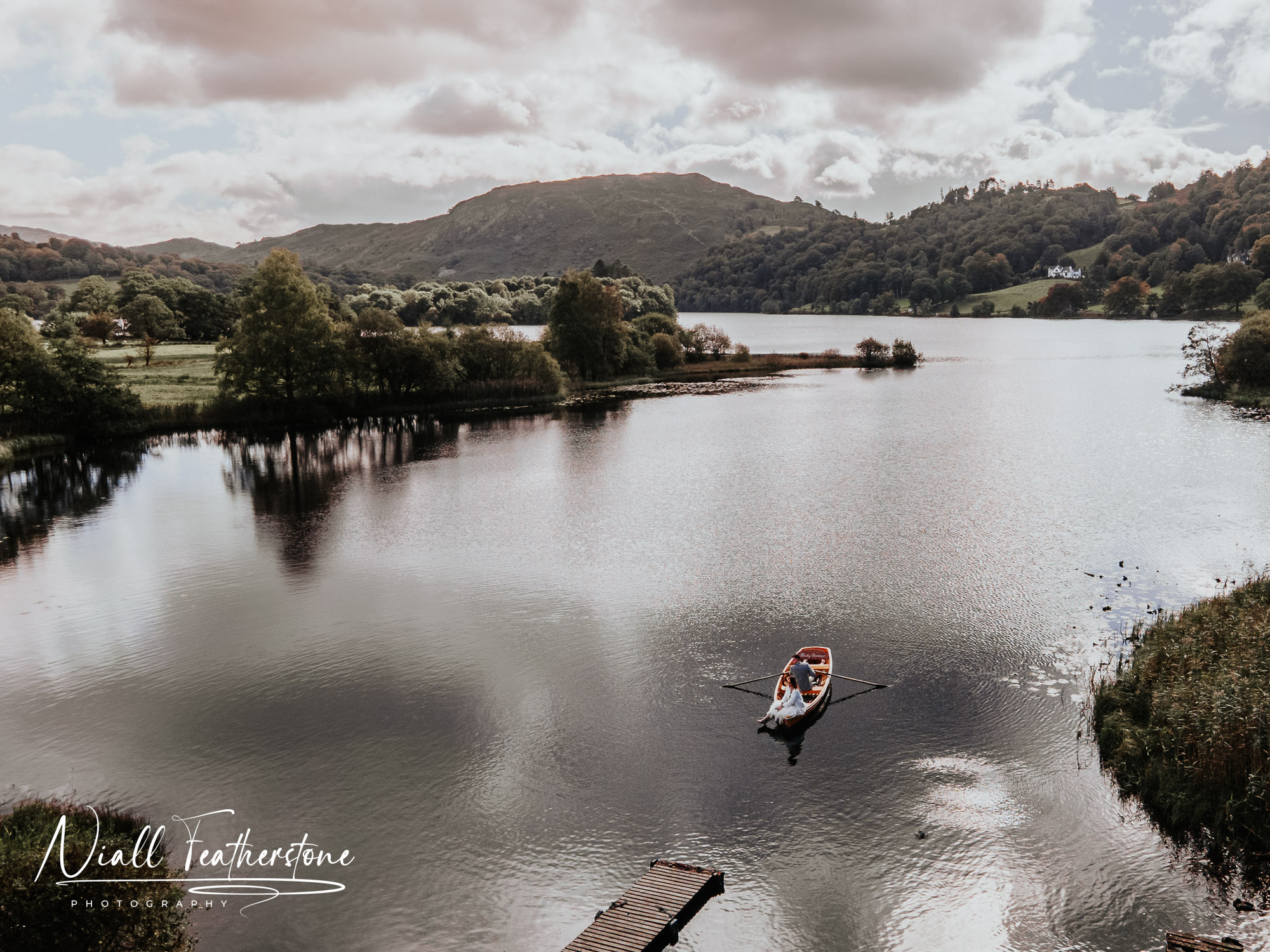 Wedding couple on a rowing boat in the Lake District Drone photograph