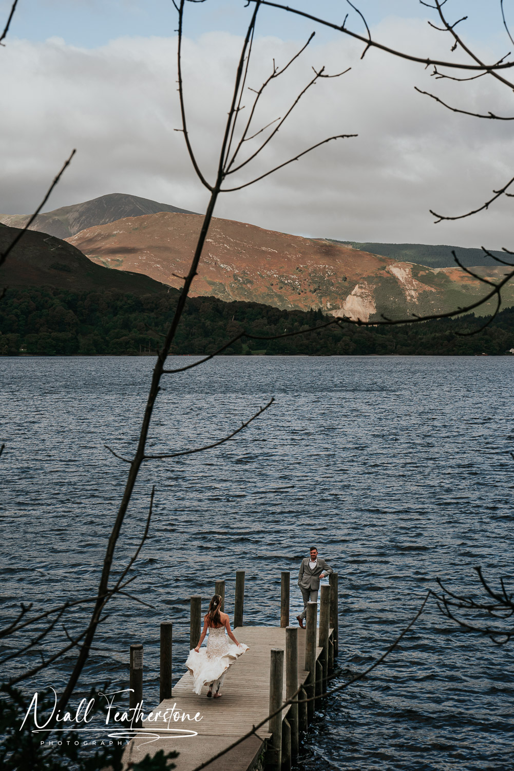 Wedding Couple Posed on a Pier in the Lake District