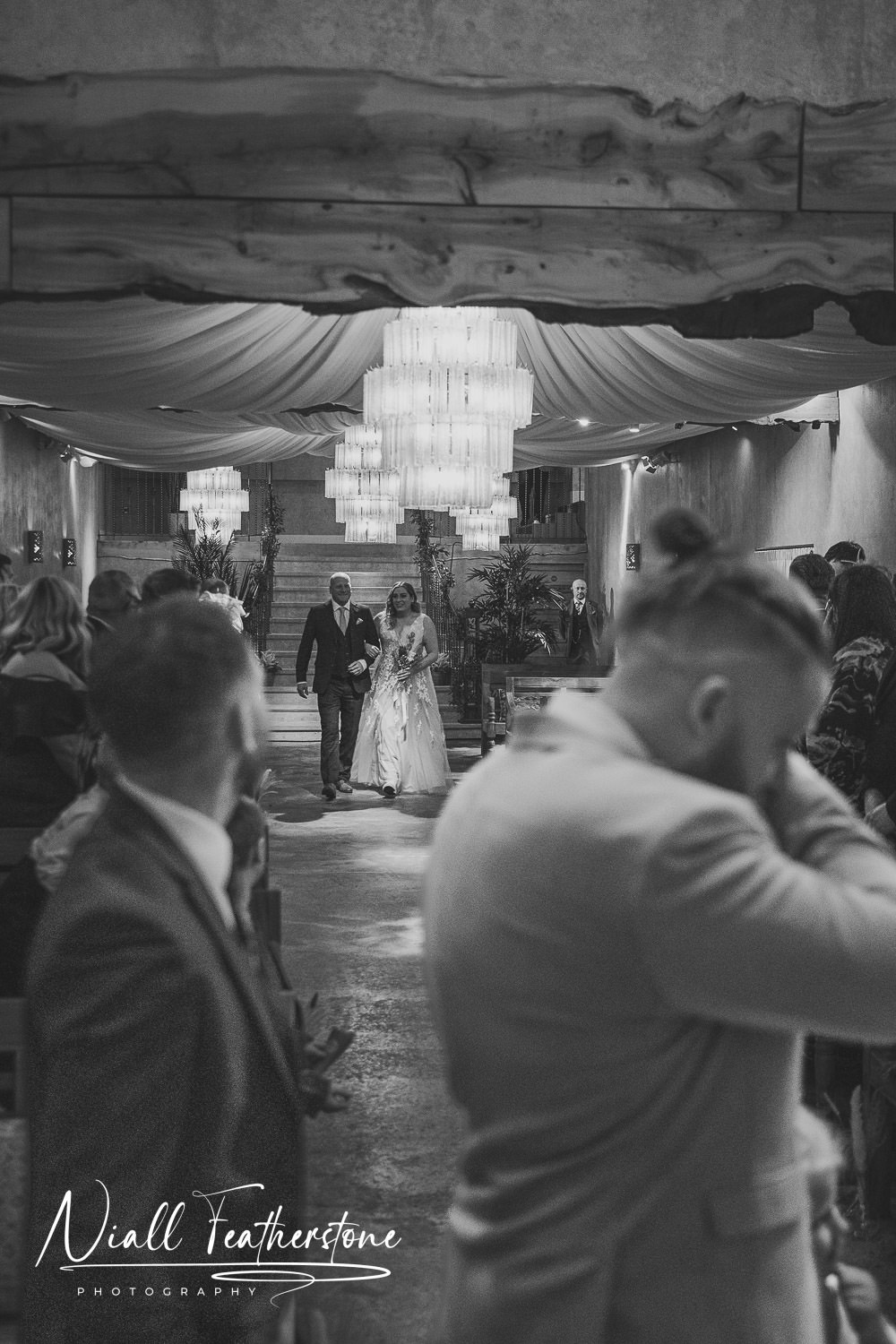 Bride walking down the aisle at Runafarm during wedding ceremony